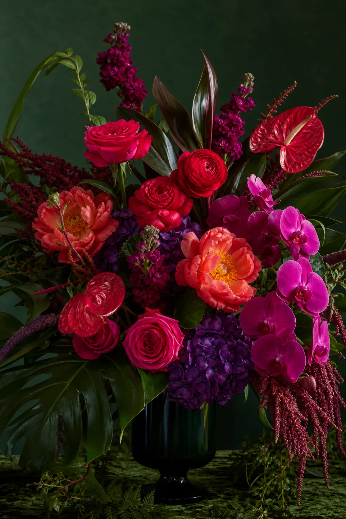 Hot pink and coral blooms with bold greenery